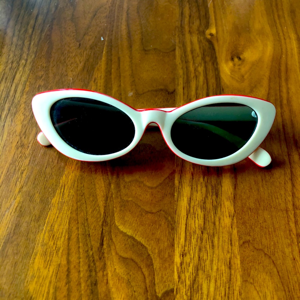 Cream and red UNIF cat eye sunglasses
